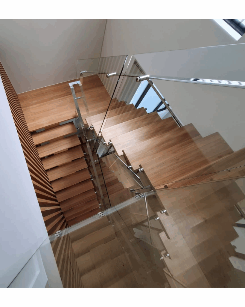 Open stair with centre box stringer, frameless glass balustrade, timber screen and stainless steel handrail
