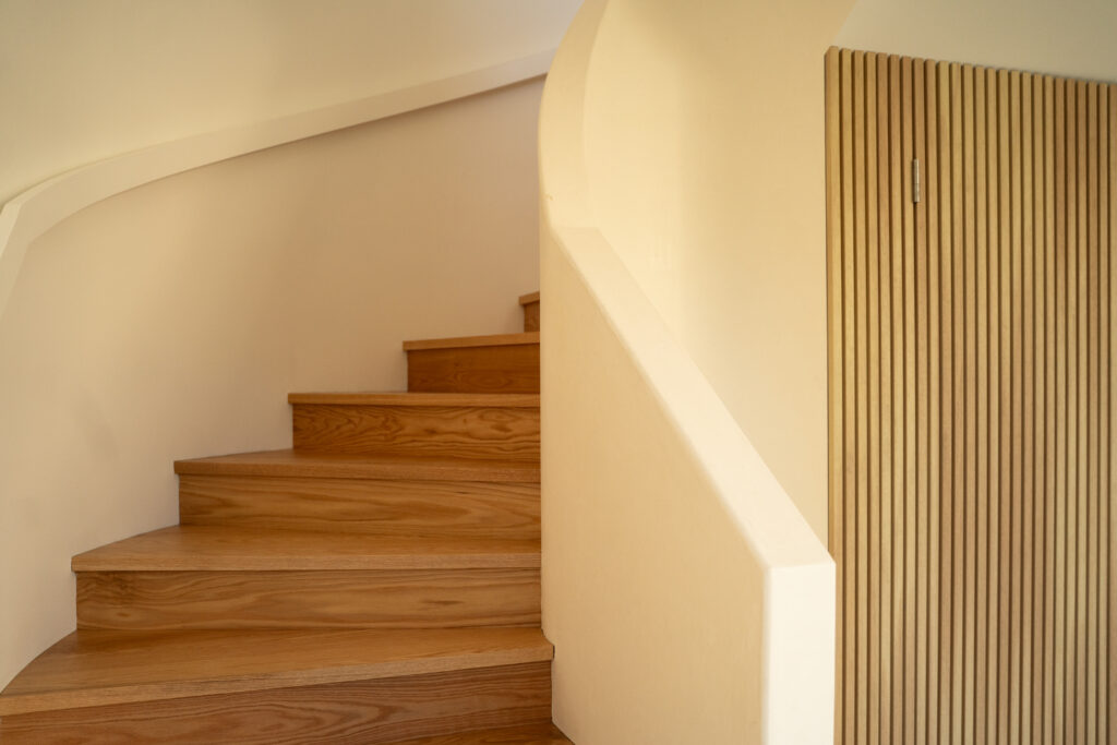 Curved stair between walls