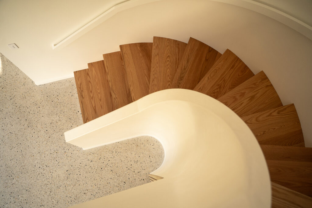 Curved stair between walls