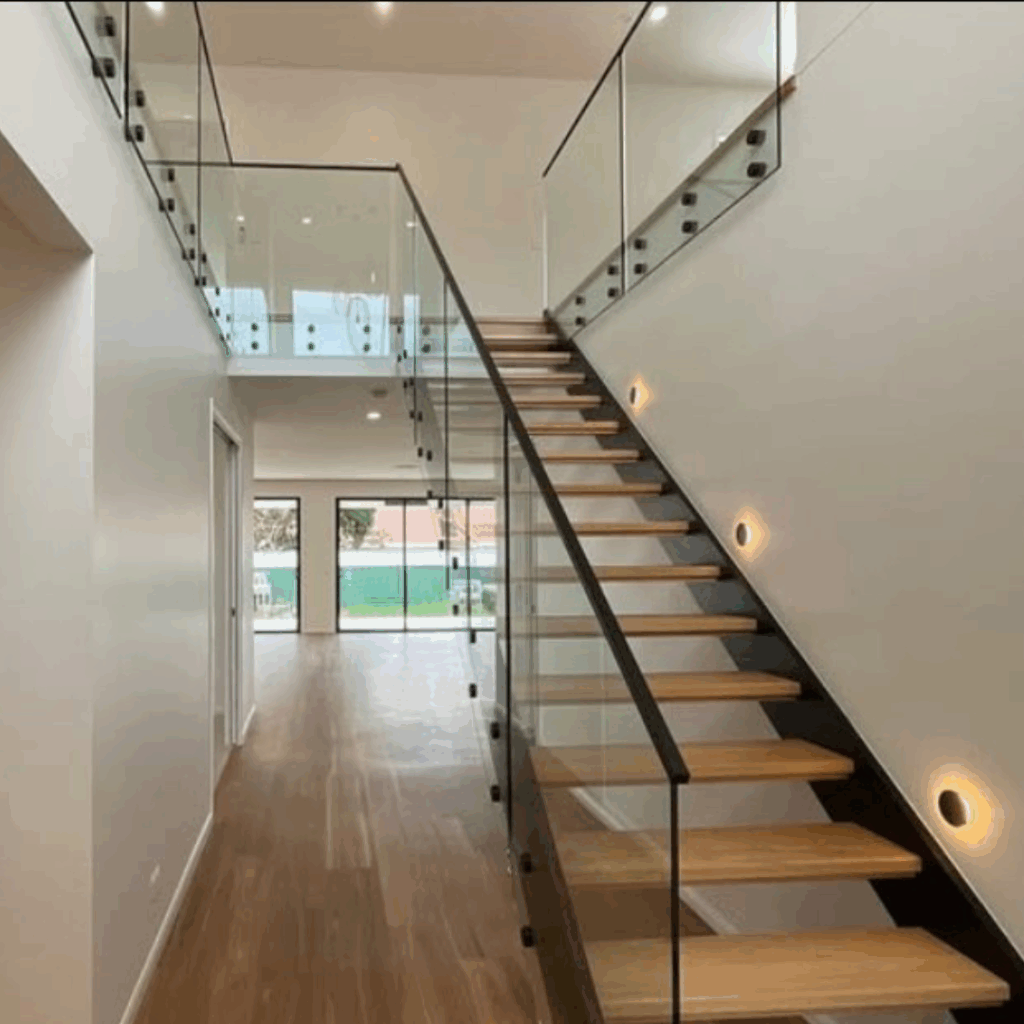Open stair with frameless glass balustrade