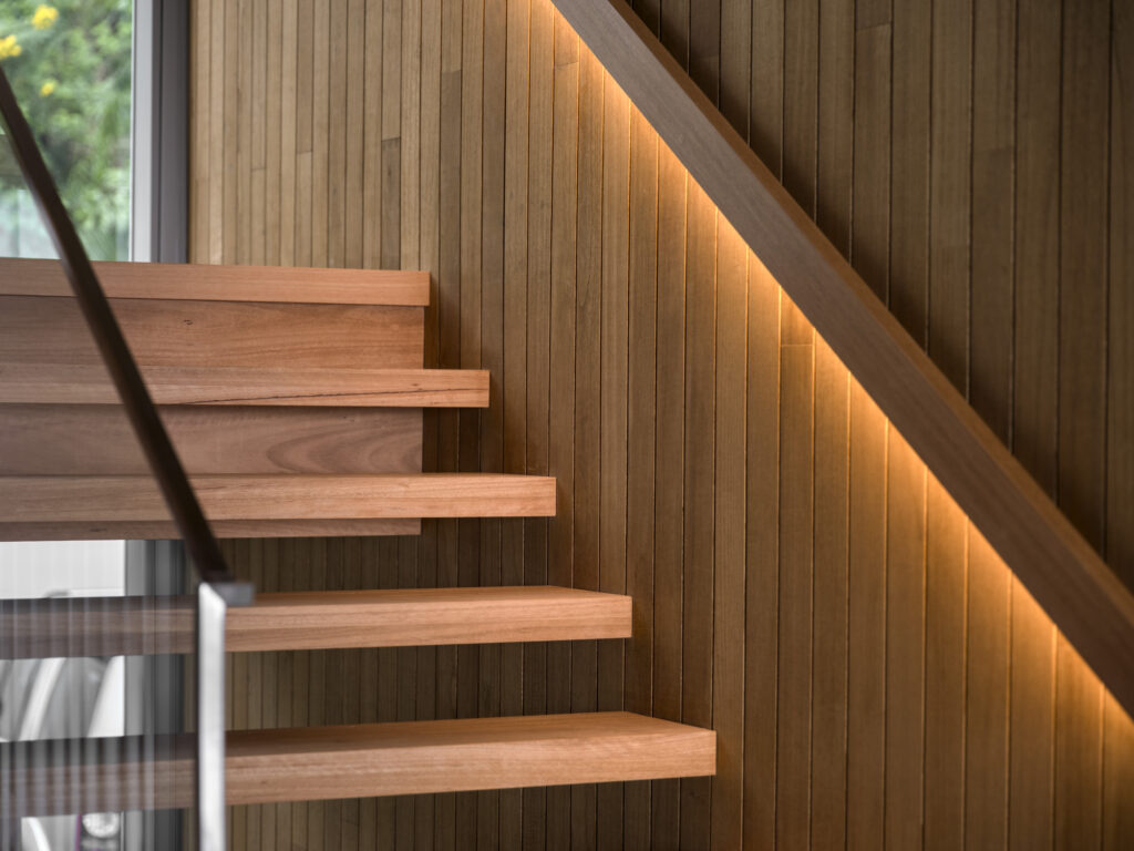 Open stair design showing LED wall rail