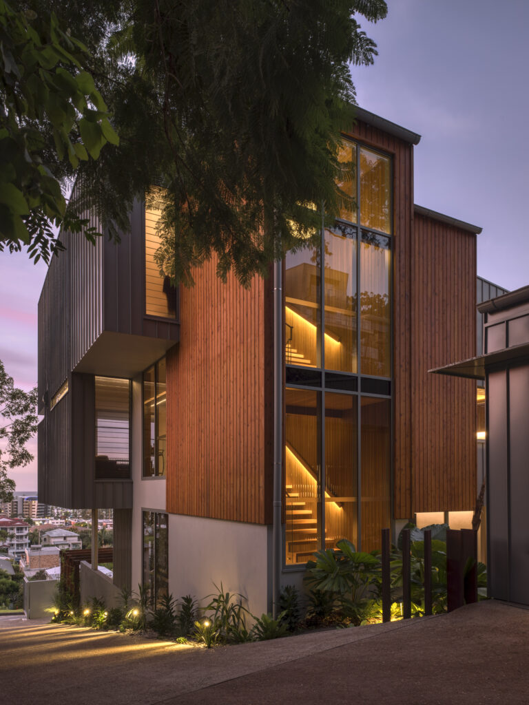 External view of house showing stairwell in the evening