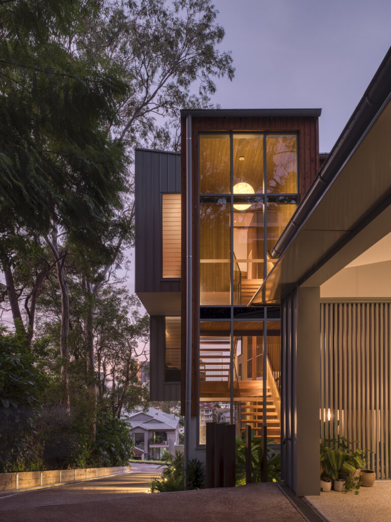 External view of house showing stairwell in the evening