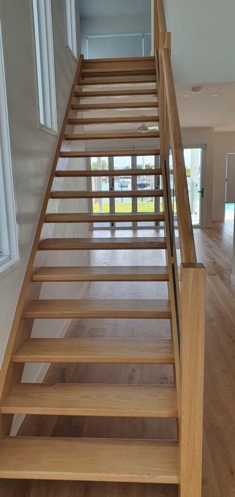 Open stair viewed from the base of the stairs