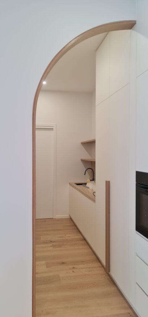 Timber capping over arched wall