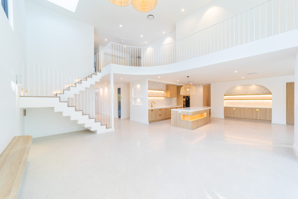 View of stair and balustrade in the foreground with kitchen in the background