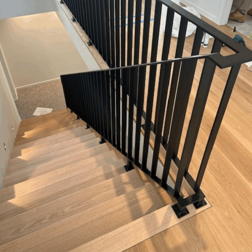 Looking down staircase with powder coated balustrade