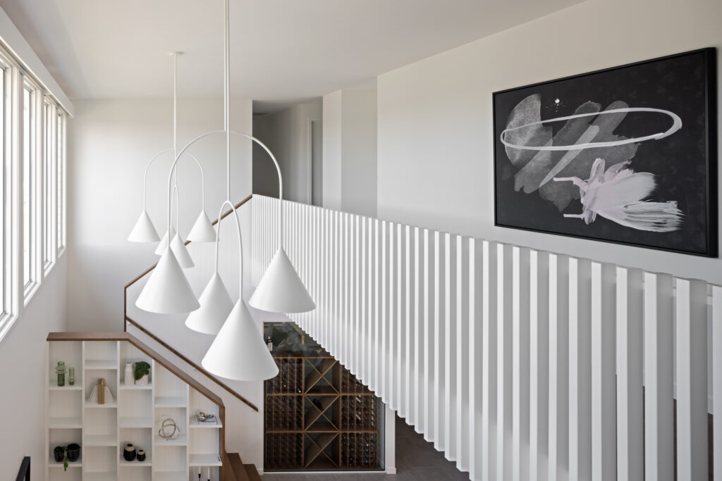 View of open void area with balustrade and light penants