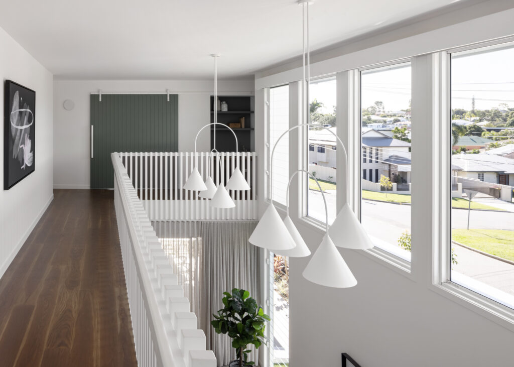 View of open void area with balustrade and light penants