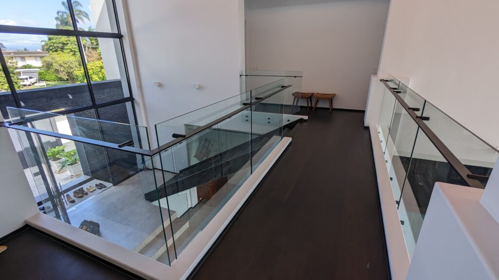 Frameless glass balustrade over void area