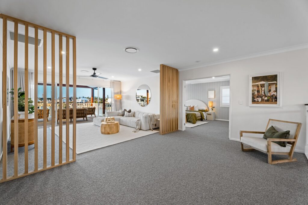 Loungeroom with feature screens looking out onto waterfront views
