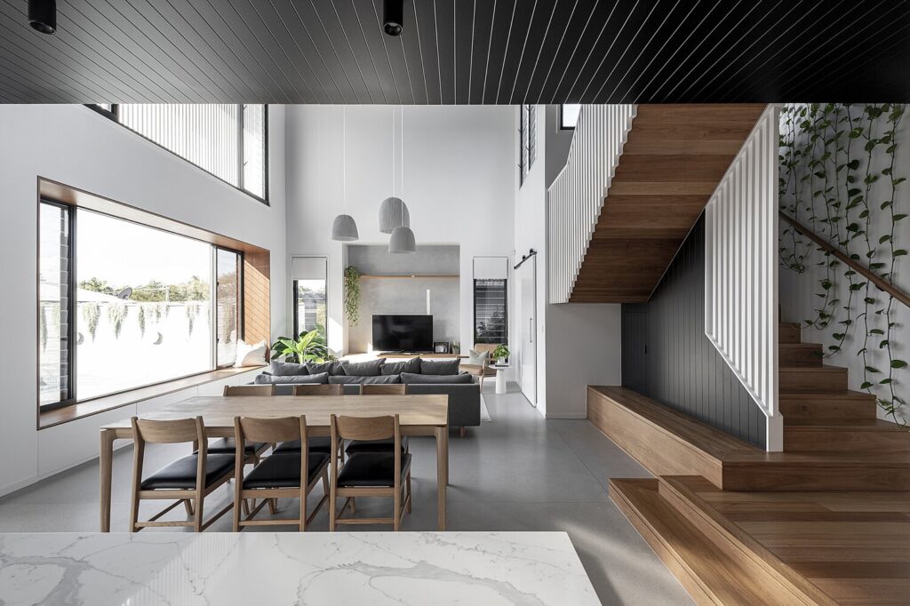 Living room and kitchen with timber stair and screen balustrade