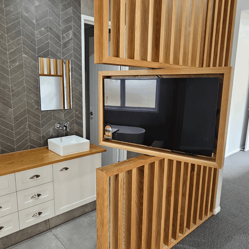 Room divider screen to bedroom and ensuite bathroom with feature television mount