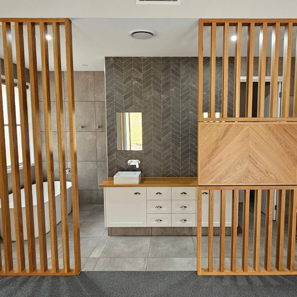 Room divider screen to bedroom and ensuite bathroom with feature television mount